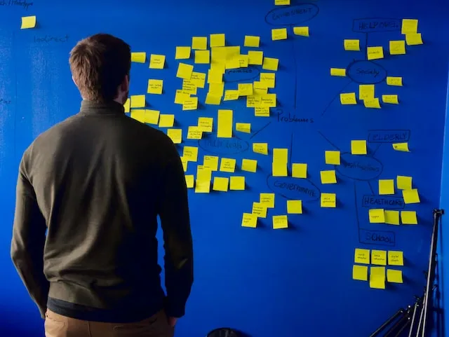 Person planning work on a kanban board
